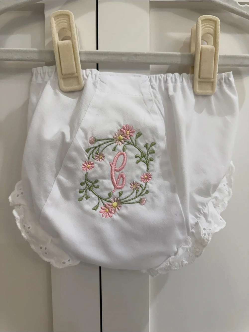 Pair of IC COLLECTIONS White Ruffle Diaper Covers w/ “C” Floral Monograms